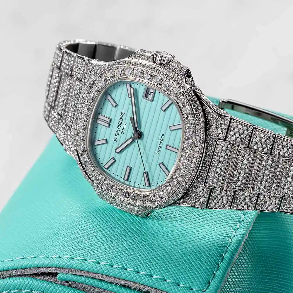 Side view of Custom Diamond Set Patek Philippe 5711 laying on a blue tiffany pouch
