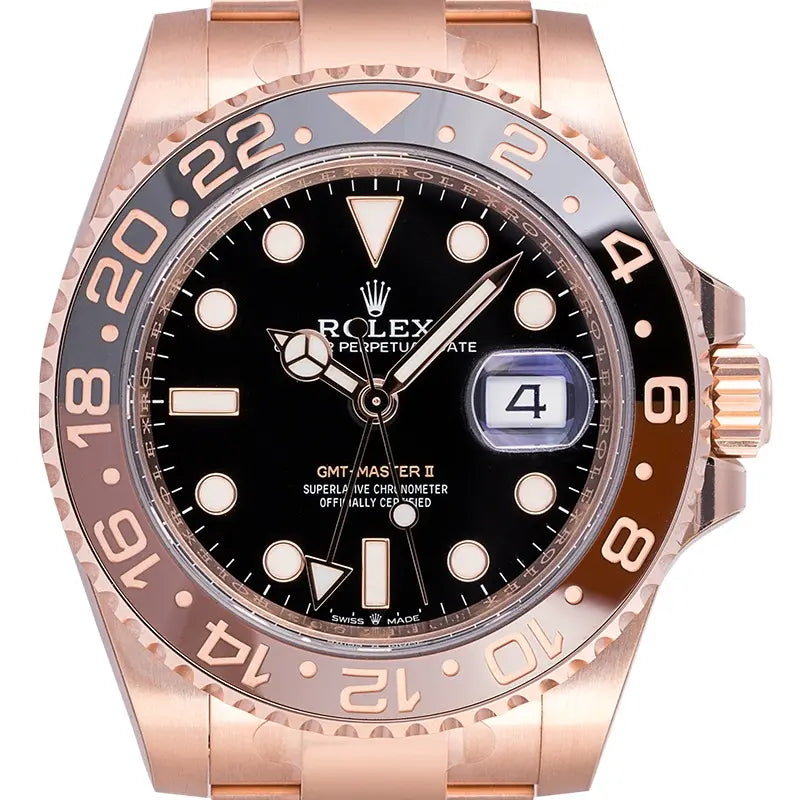 Close up of the Rolex GMT-Master II watch in 18ct Everose Gold with black dial and black brown bezel reference 126715CHNR.